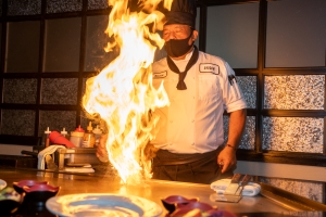 Hibachi chef firing up grill at Shogun Japanese Steakhouse