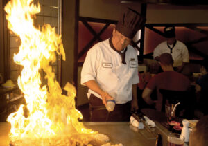 Eat What You Want Day - Chef preparing meals on a teppan grill.